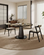 Table à manger moderne aspect marbre avec piètement central en bois