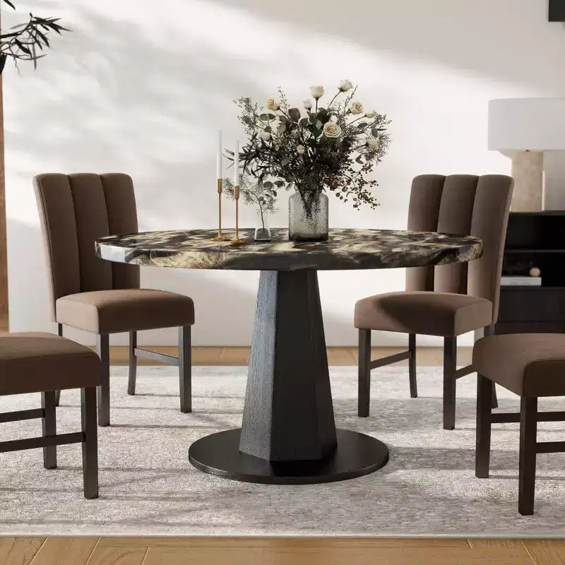 Table à manger moderne aspect marbre avec piètement central en bois