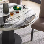 Table à manger moderne aspect marbre avec piètement central en bois