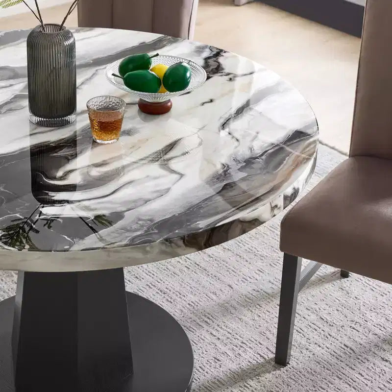 Table à manger moderne aspect marbre avec piètement central en bois
