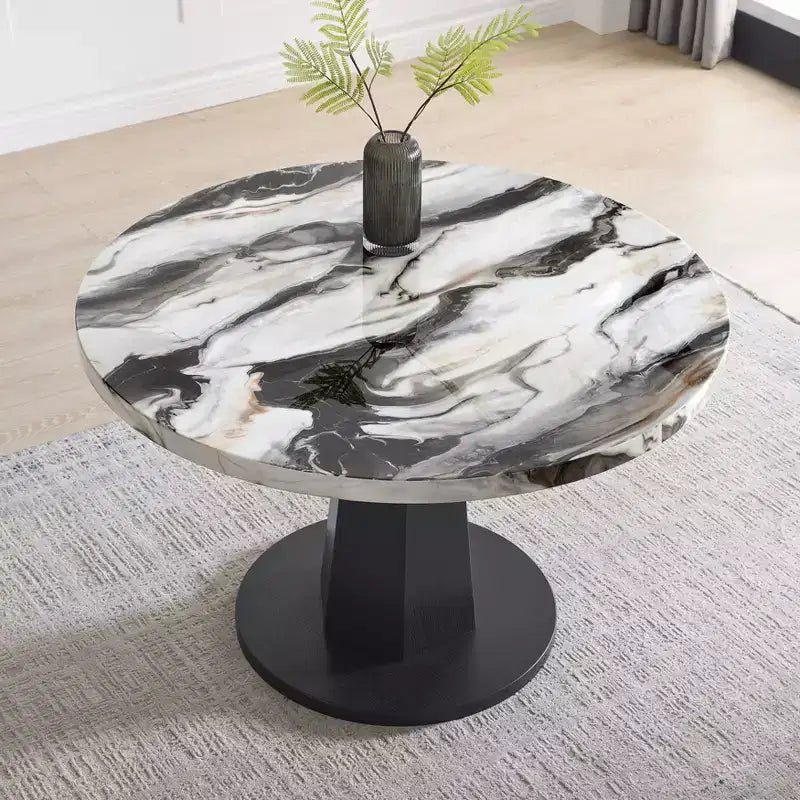 Table à manger moderne aspect marbre avec piètement central en bois